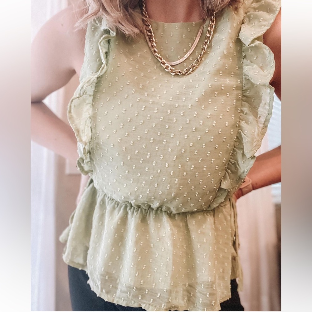 Green pompom blouse